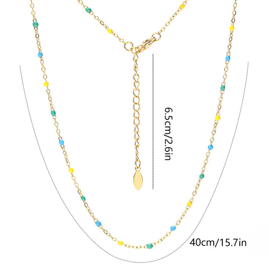 Collana con catena a maglie in acciaio inossidabile rosa shocking e perline smaltate color oro.